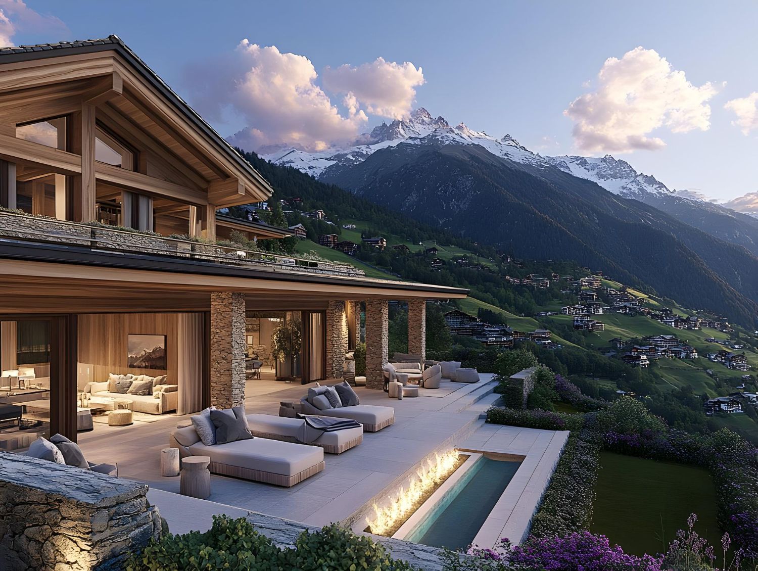 Luxury mountain villa with stone terraces, pool, and lounge chairs at sunset overlooking snowy peaks