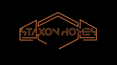 Copper neon-style STAXONHOMES logo on a black background with a house outline
