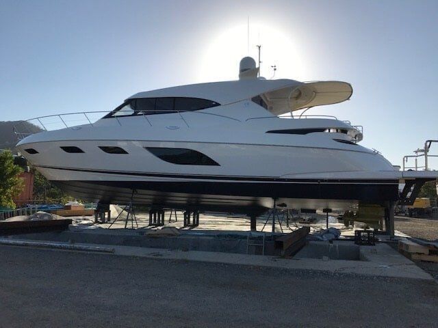 A Large White Yacht Is Docked In A Marina — Edge's Boatyard In Jubilee Pocket, QLD