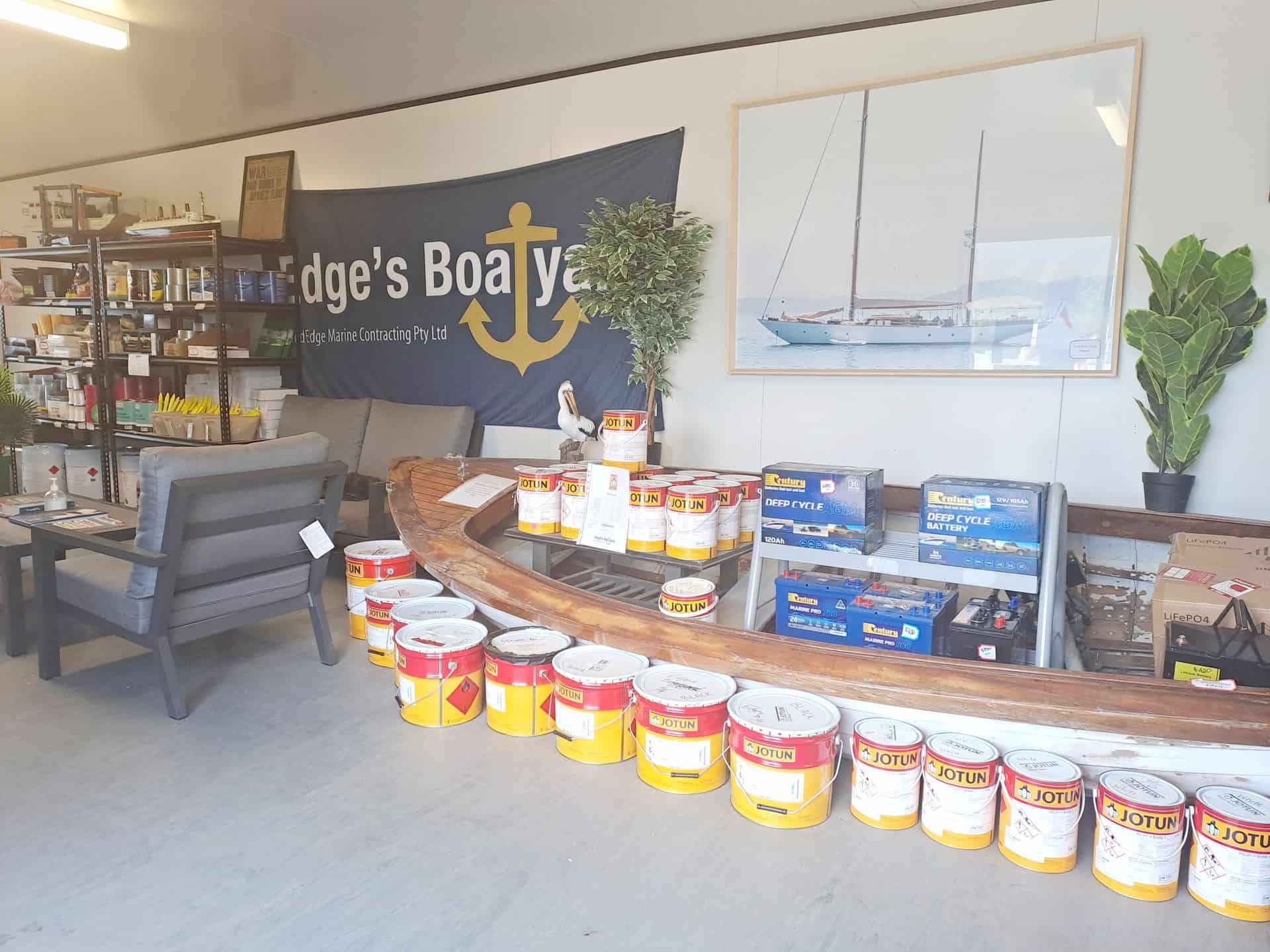 A Room with a boat Shaped Counter and a sign that says ridge 's boat yard — Edge's Boatyard In Jubilee Pocket, QLD