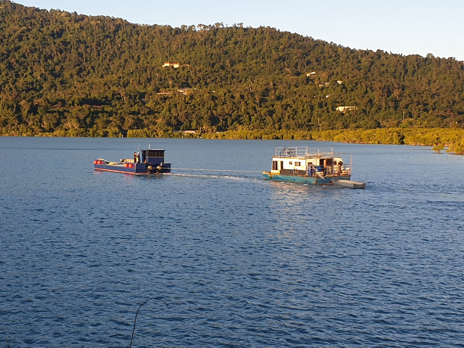 A Large Boat Is Being Painted In A Marina — Edge's Boatyard In Jubilee Pocket, QLD