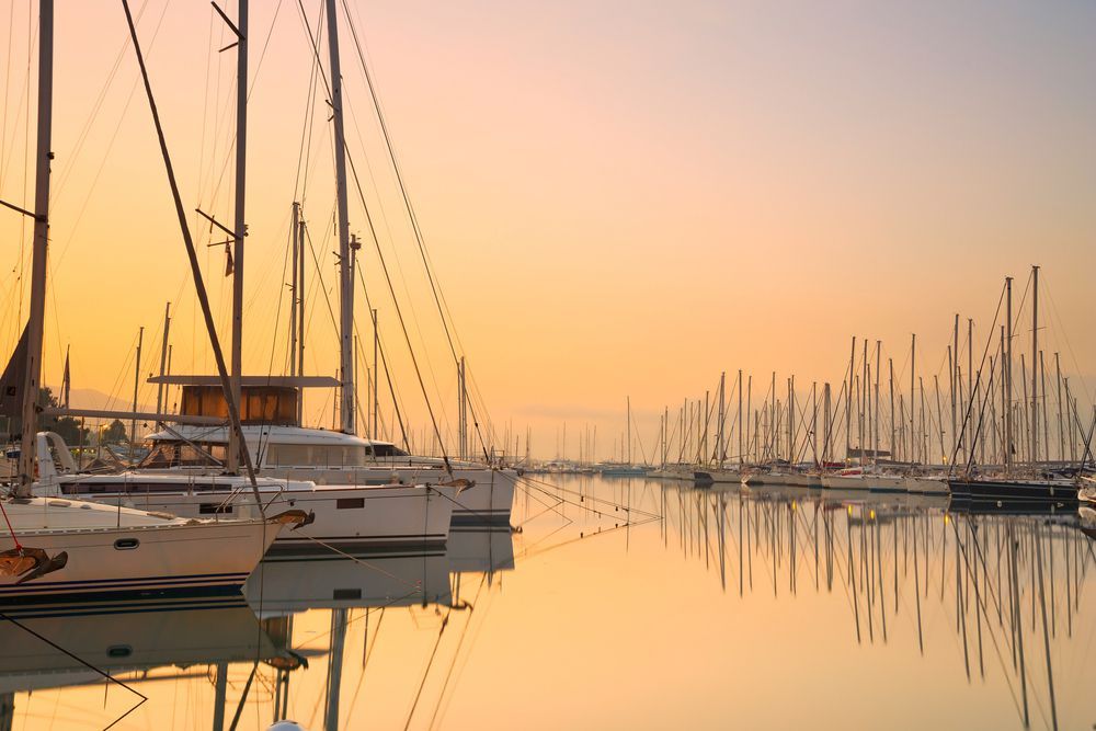 A Large White Boat Is Floating On Top Of A Body Of Water — Edge's Boatyard In Jubilee Pocket, QLD