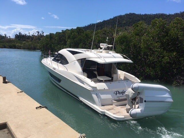 A White Boat With The Name Prestige On The Back — Edge's Boatyard In Jubilee Pocket, QLD