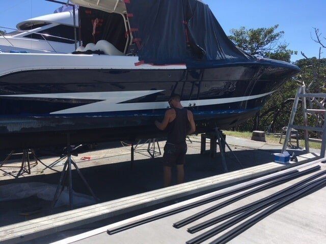 A Man Is Standing beside Of A Boat — Edge's Boatyard In Jubilee Pocket, QLD