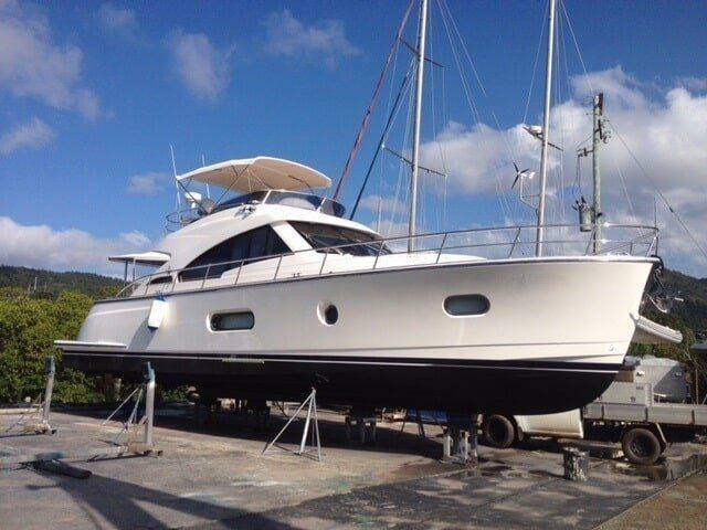 A Large White Sailboat Is Docked In A Marina — Edge's Boatyard In Jubilee Pocket, QLD