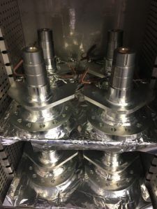 Large steel hubs being baked for hydrogen embrittlement after zinc plating by Seminole Metal Finishing.