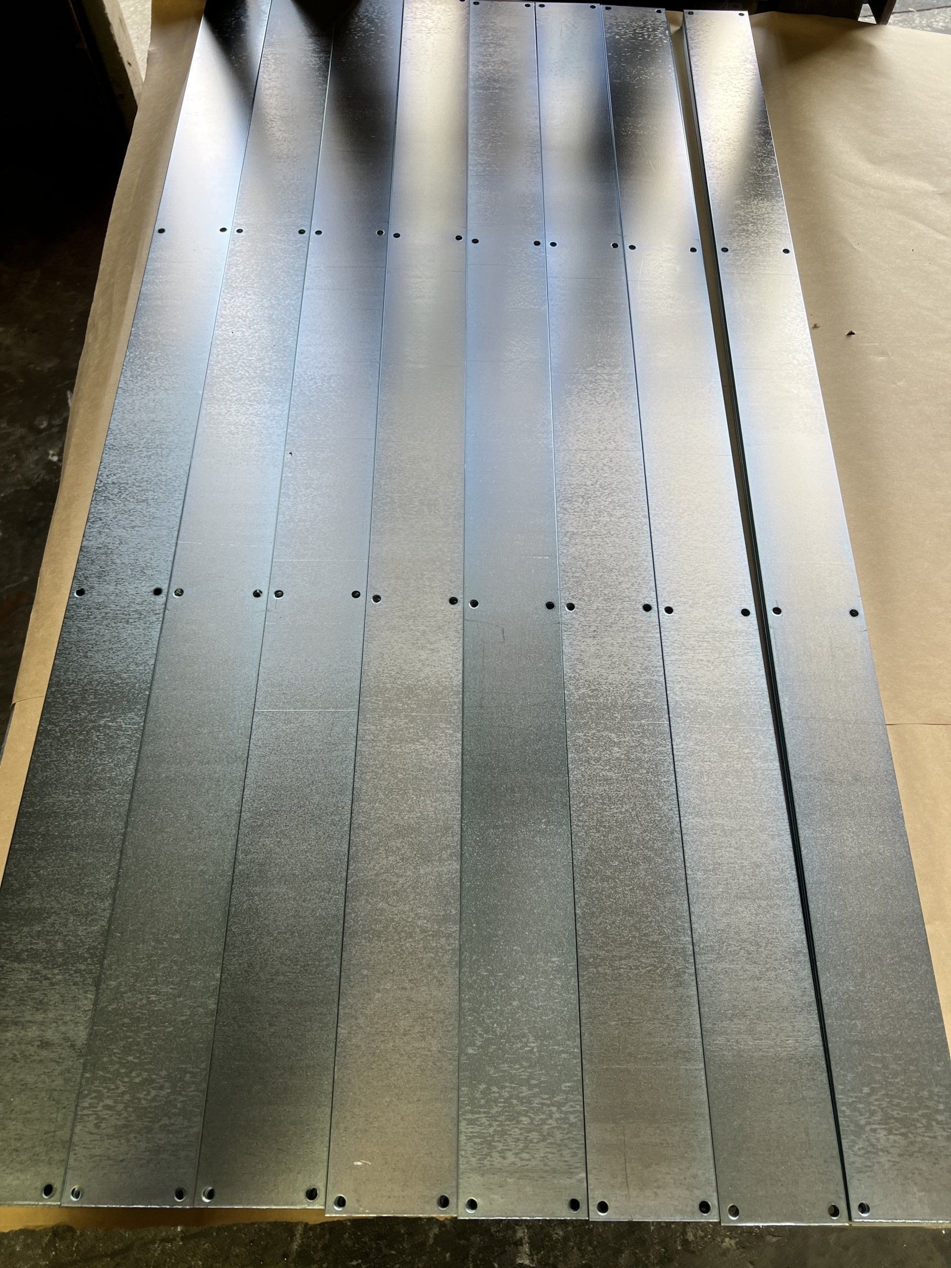 Clear zinc plated steel plates by Seminole Metal Finishing.