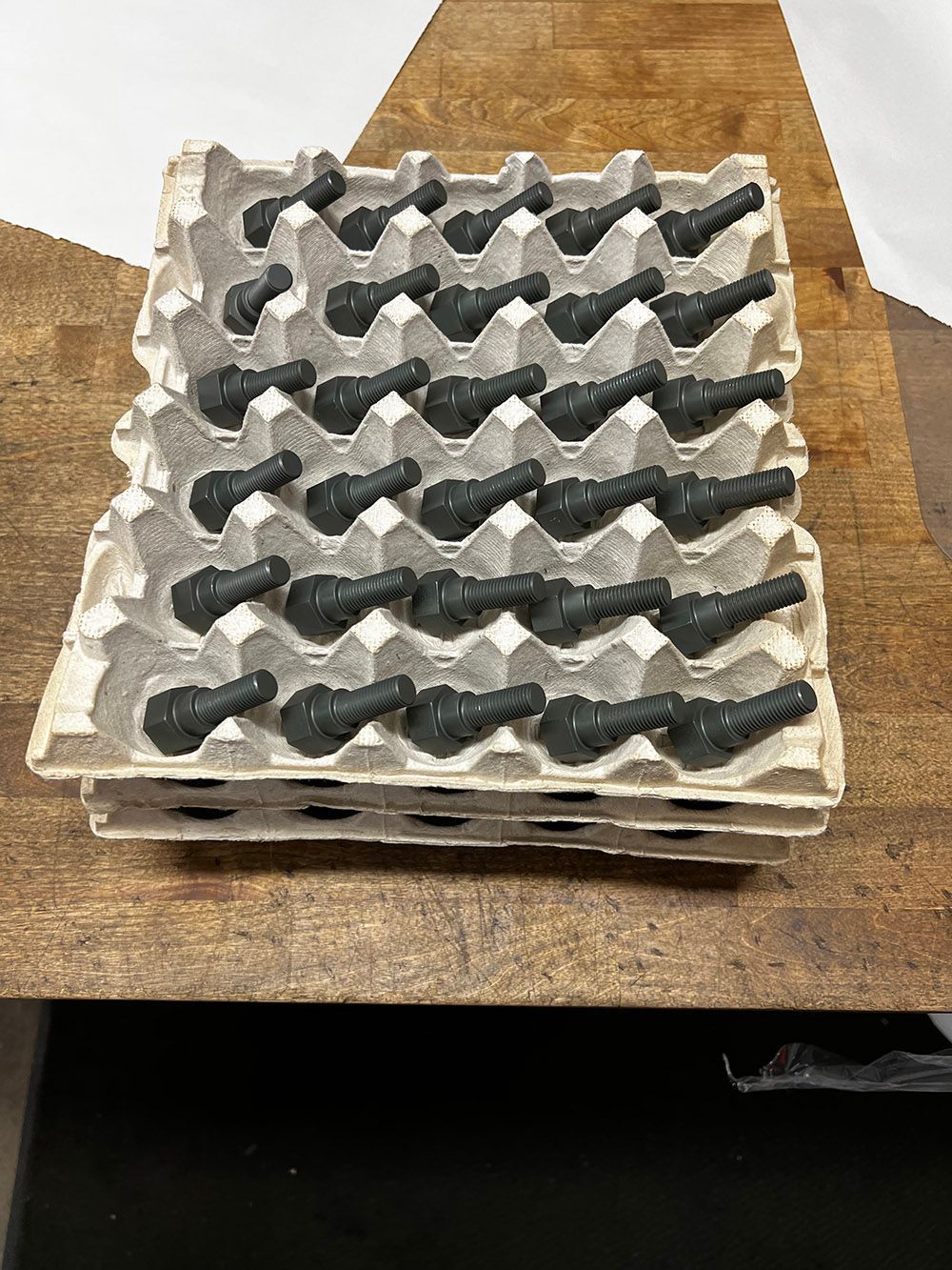 Bolts applied with dry film lubricant by Seminole Metal Finishing.