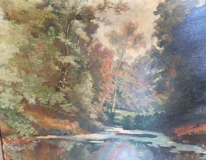 Soft pastel landscape of a wooded stream with autumn-colored trees reflecting in calm water.