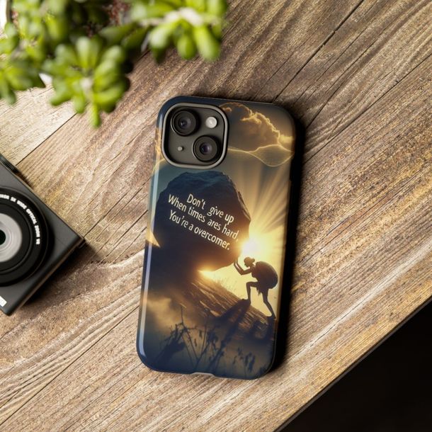 A phone case with a picture of a man climbing a mountain