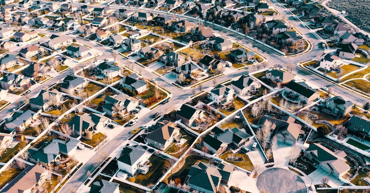 An aerial view of a residential area with lots of houses and trees.