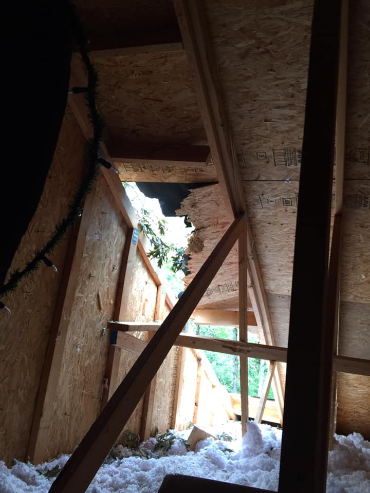 Damaged roof showing interior damage