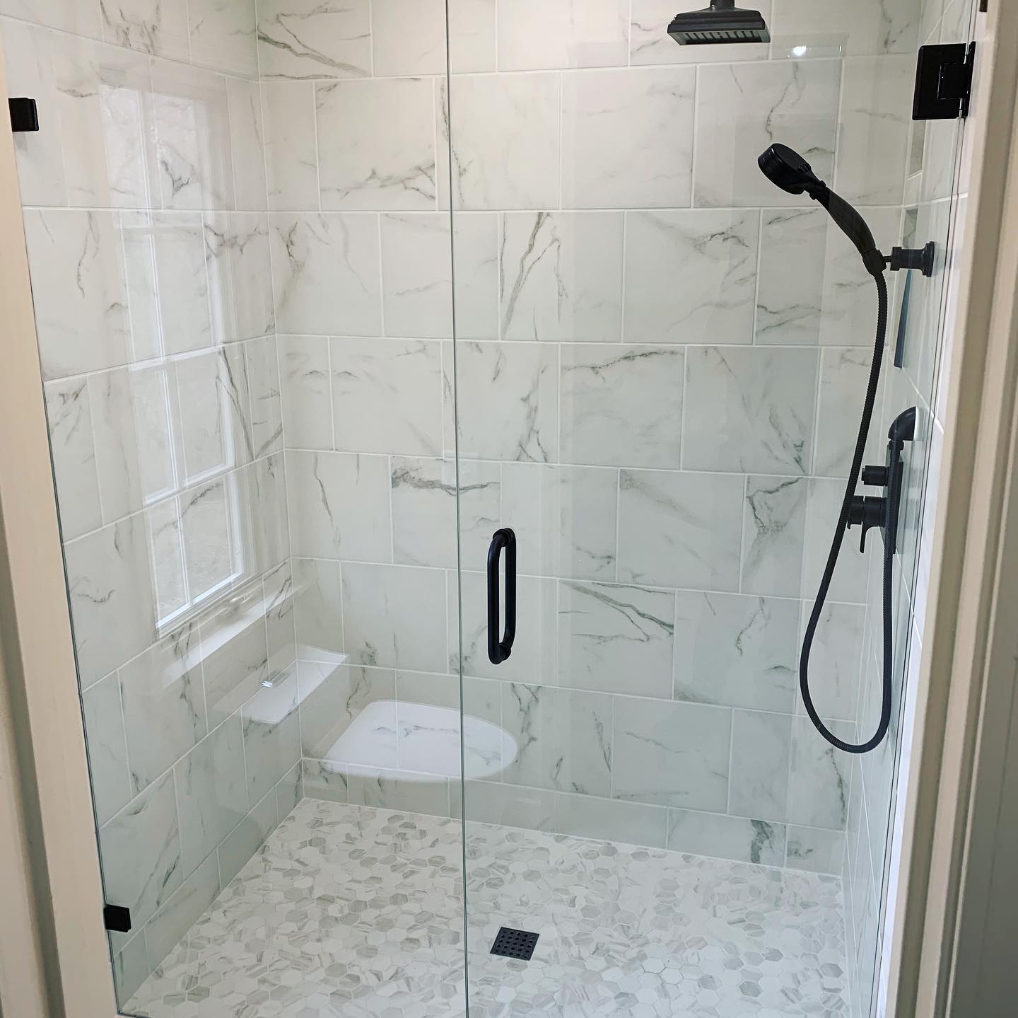 tiled shower by a modern touch