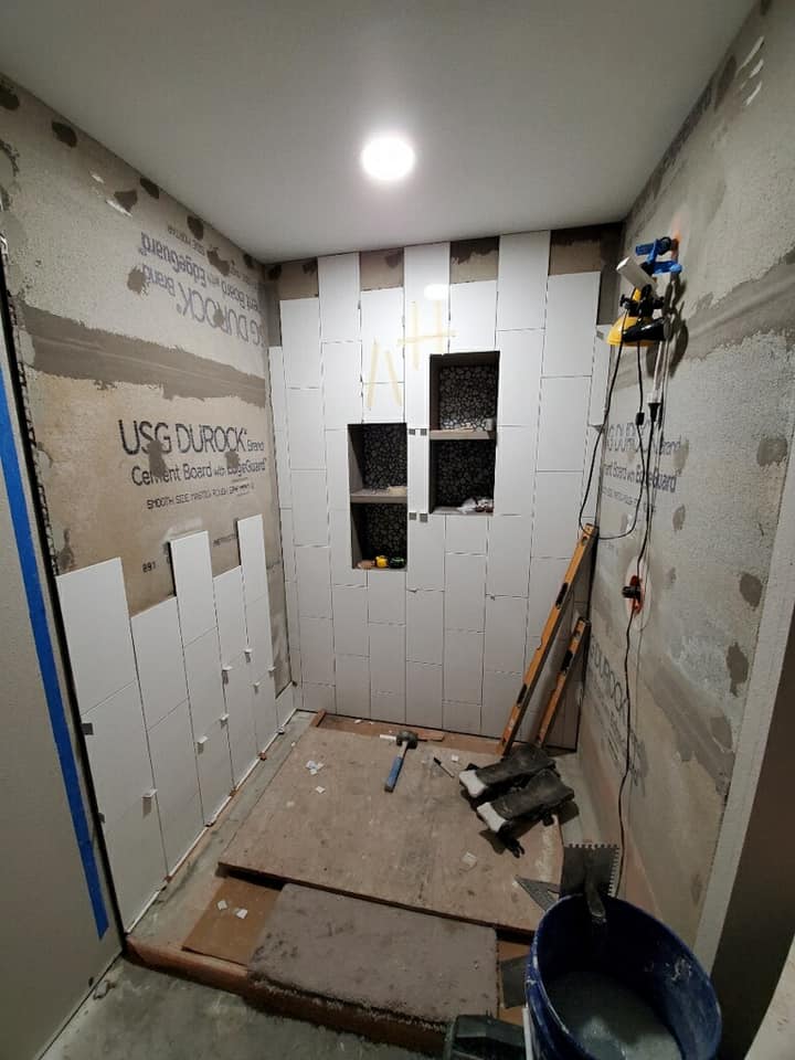 progress picture of tiling a bathroom done by a modern touch