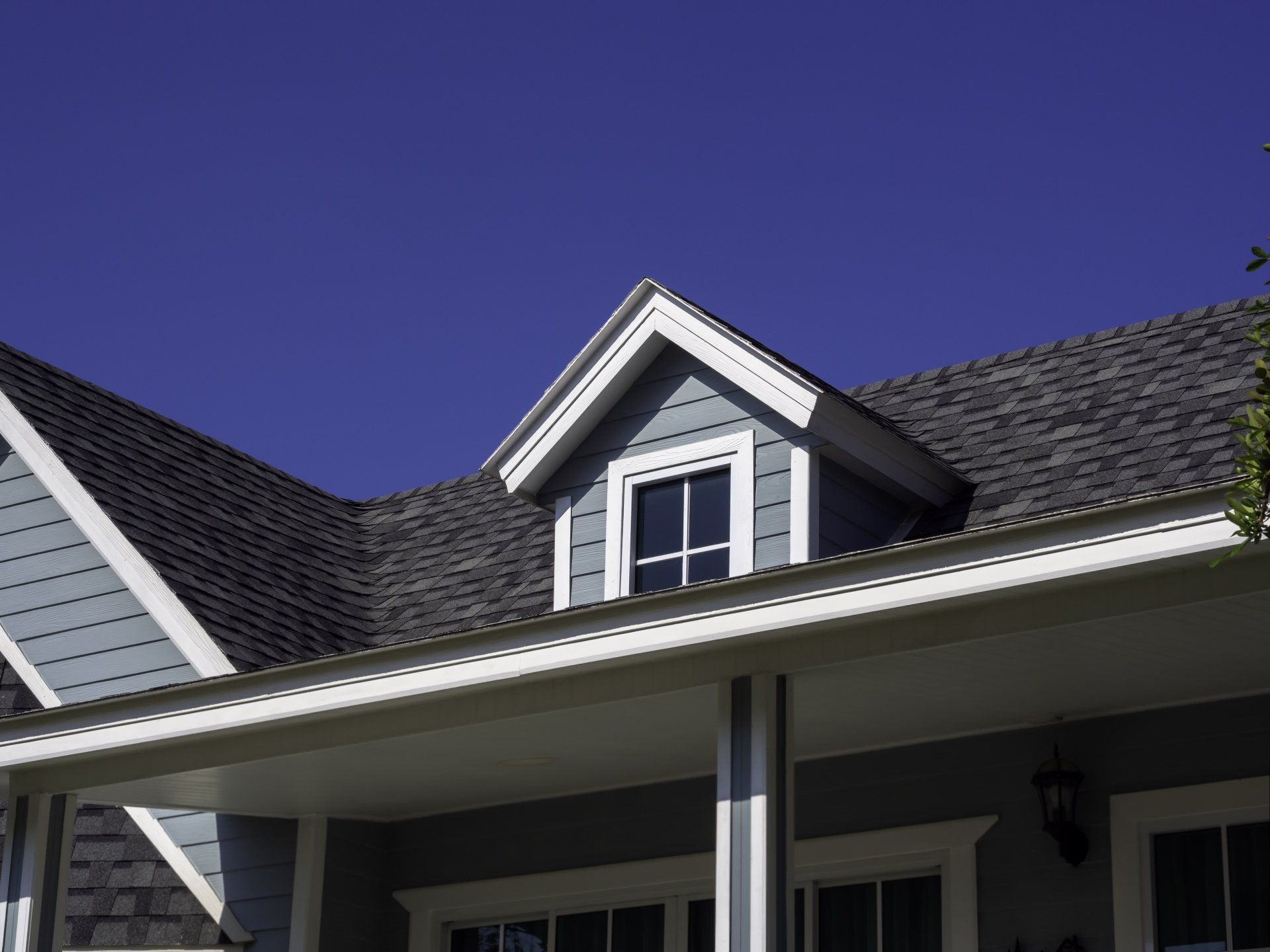 A home getting siding added by A Modern Touch