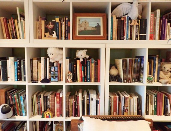 A bookshelf with a picture of a castle on it