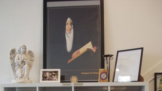 A shelf with a picture of a nun on it