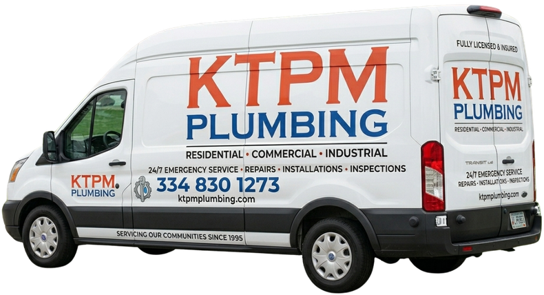 White KTPM Plumbing van with orange and blue company branding and contact number 334 830 1275