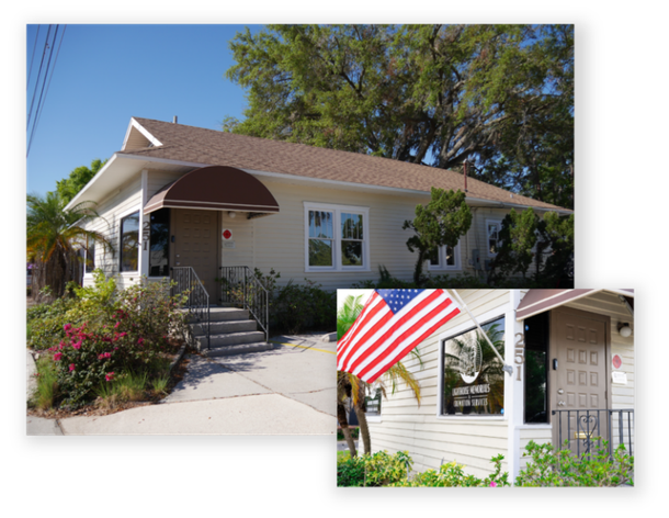 Single-story house with white siding and a brown awning; inset shows an American flag by the front porch.