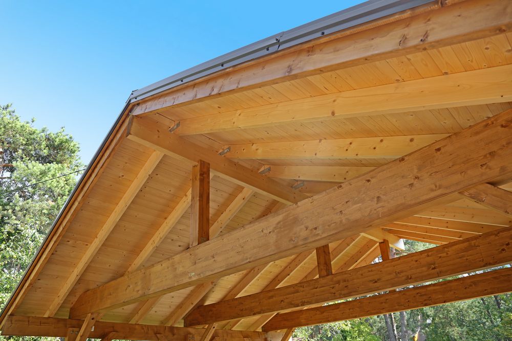 A Close Up of a Wooden Roof With a Blue Sky in the Background — Byron Bay Carpentry and Construction In Ballina, NSW