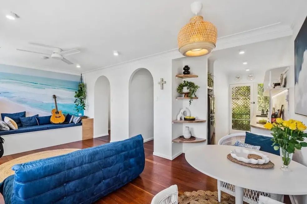 A renovated lounge with couch and dining table — Byron Bay Carpentry and Construction In Suffolk Park, NSW
