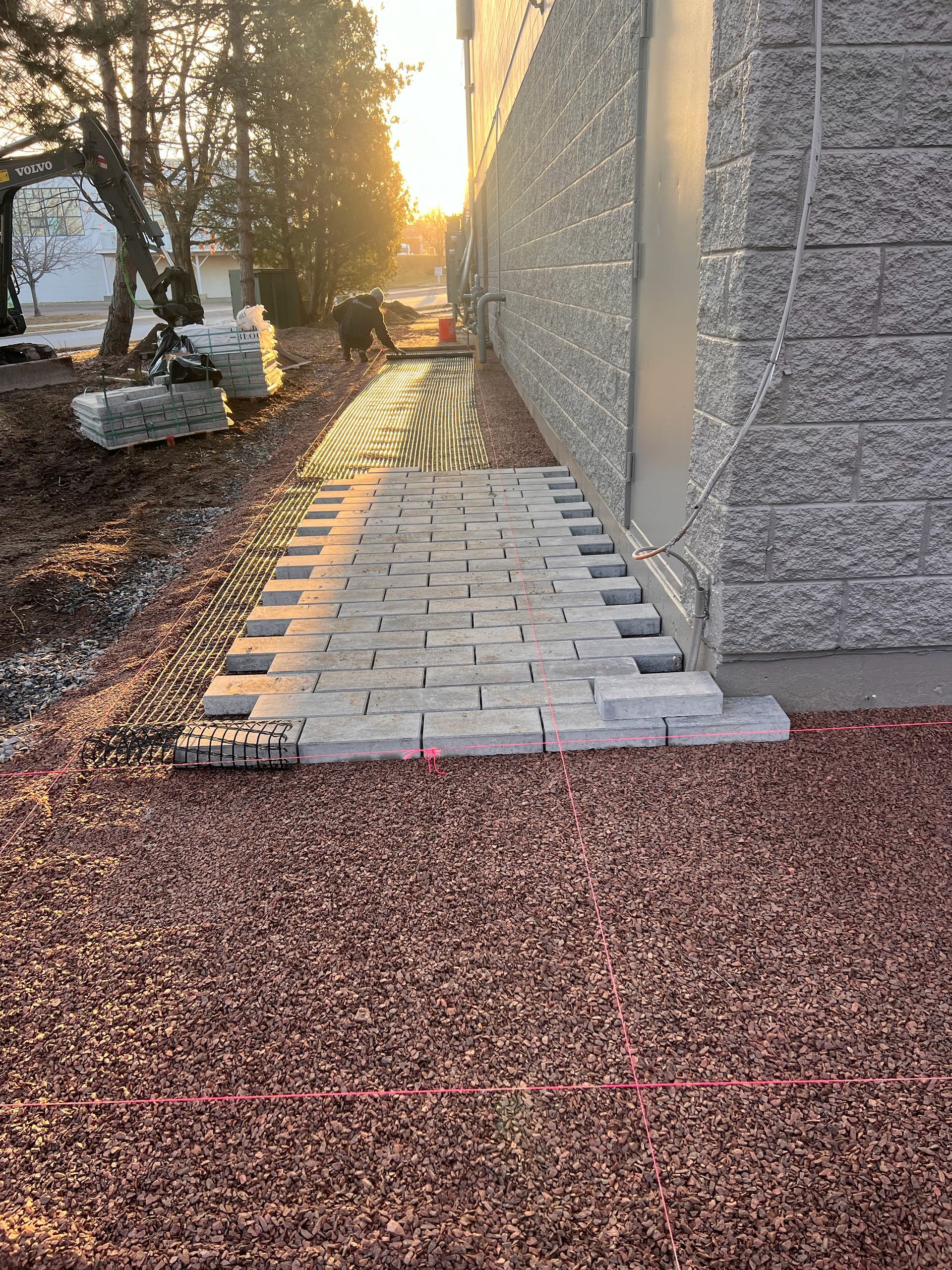 Dry-laid fieldstone patio with a stone wall border in autumn Vermont foliage