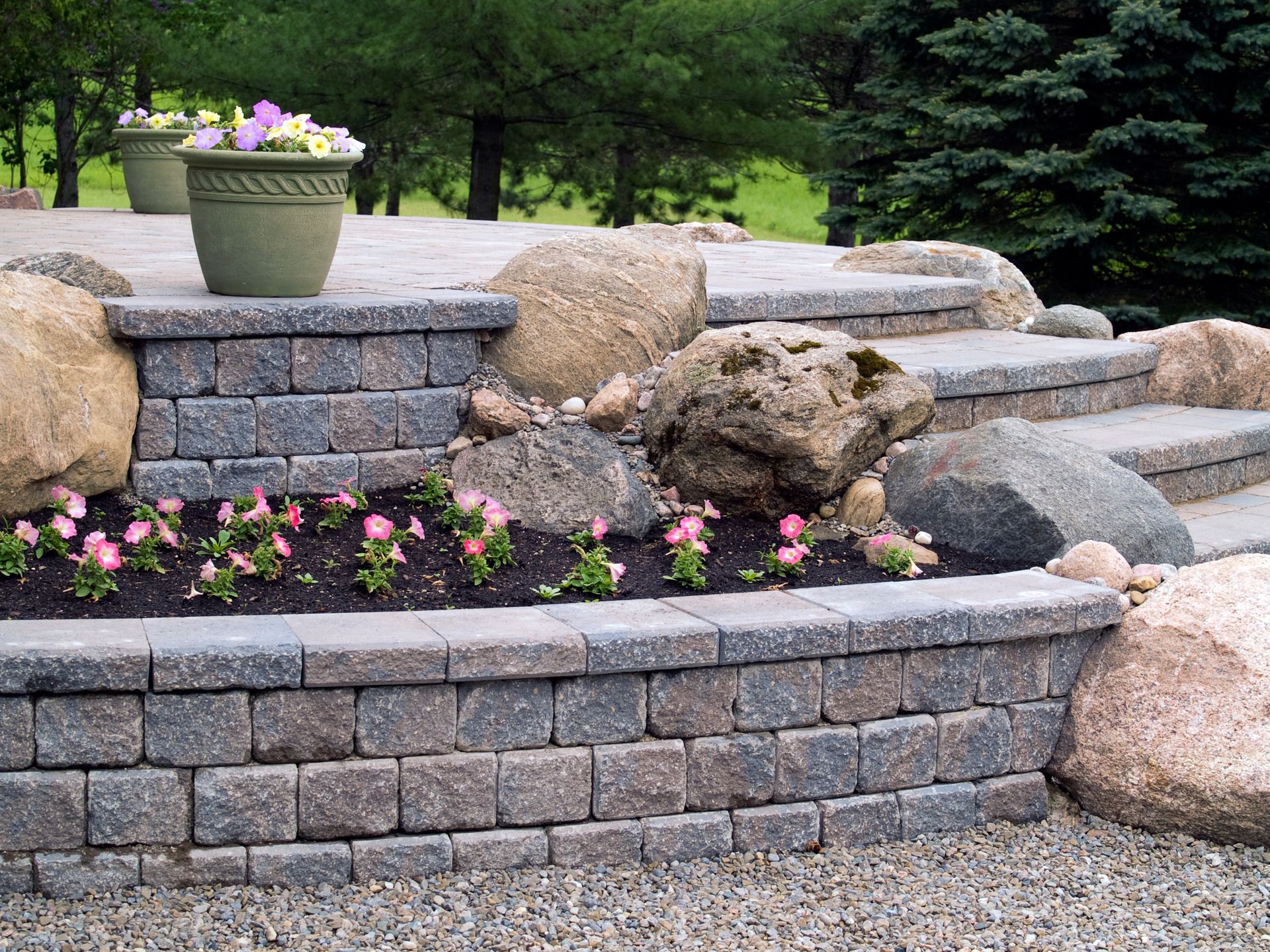 Traditional dry-stacked stone wall along a property edge