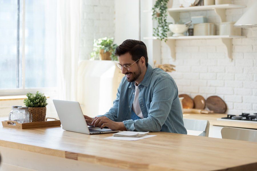 Man Using Laptop — Health Insurance in Australia