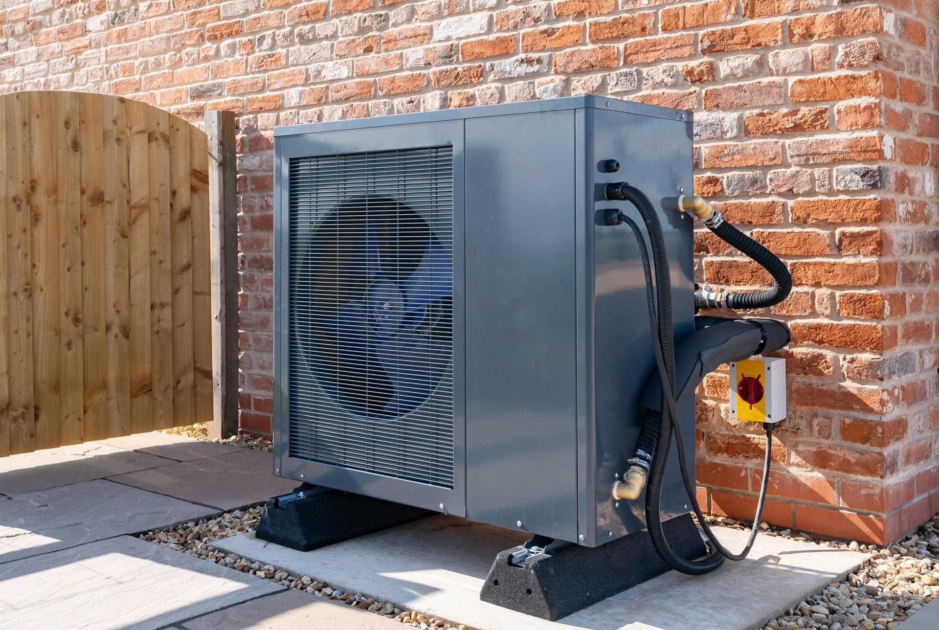 hvac technician repairing an air conditioner