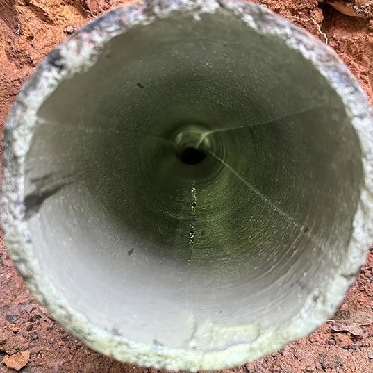 The inside of a pipe with a hole in the middle