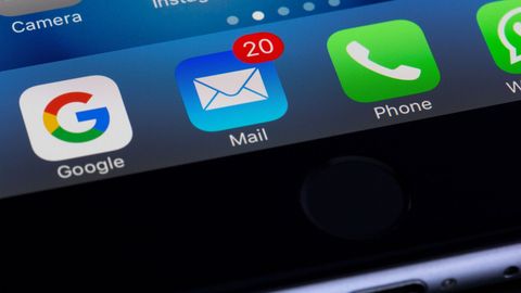 Smartphone displaying email app and notification.