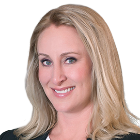 Woman with blonde hair smiles, wearing dark jacket, blue eyes.