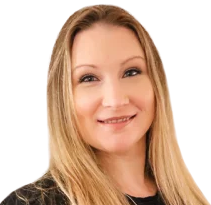 Woman with long blonde hair smiles at the camera.