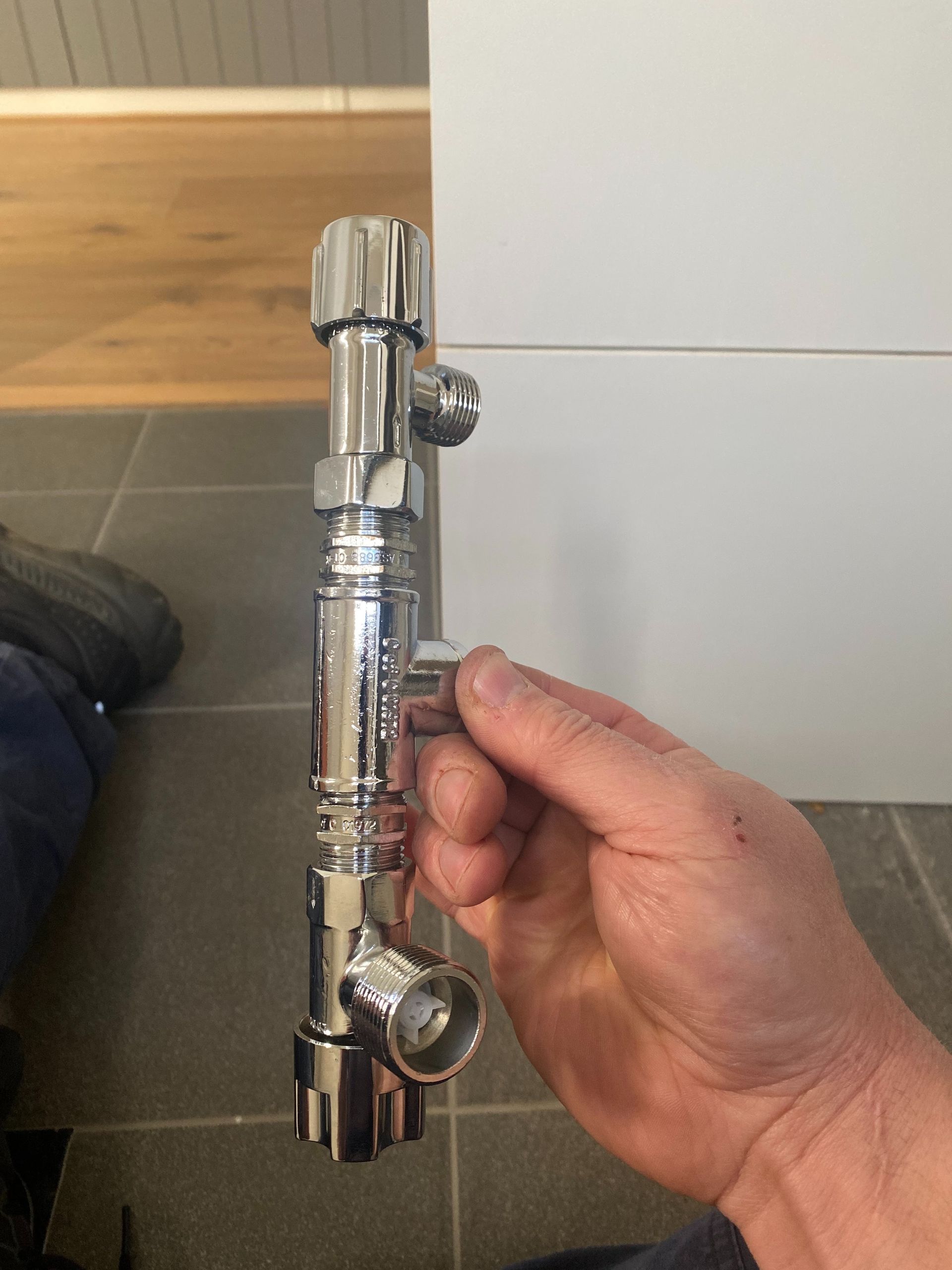 Plumber Holding a Pipe on the Southern Highlands