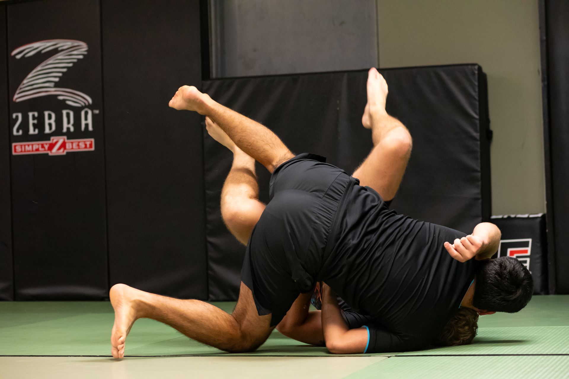 Adults drilling Brazilian Jiu-Jitsu techniques at Mason Dixon Jiu-Jitsu in East Chambersburg, PA for stress relief