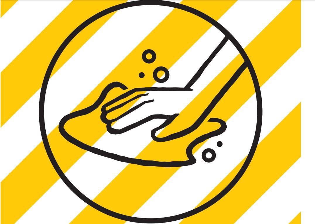 A hand is washing its hands in a circle on a yellow and white striped background.