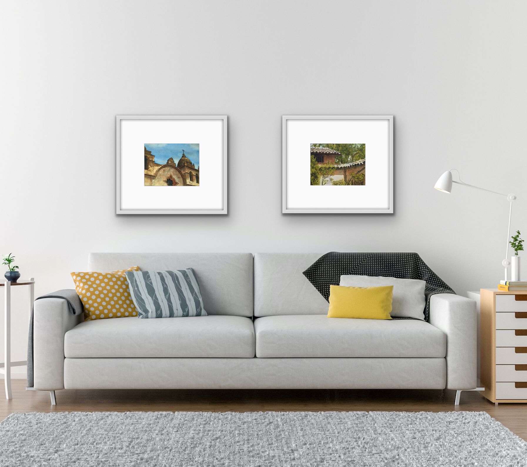 Modern living room with a gray sofa, patterned pillows, two framed pictures, and a floor lamp