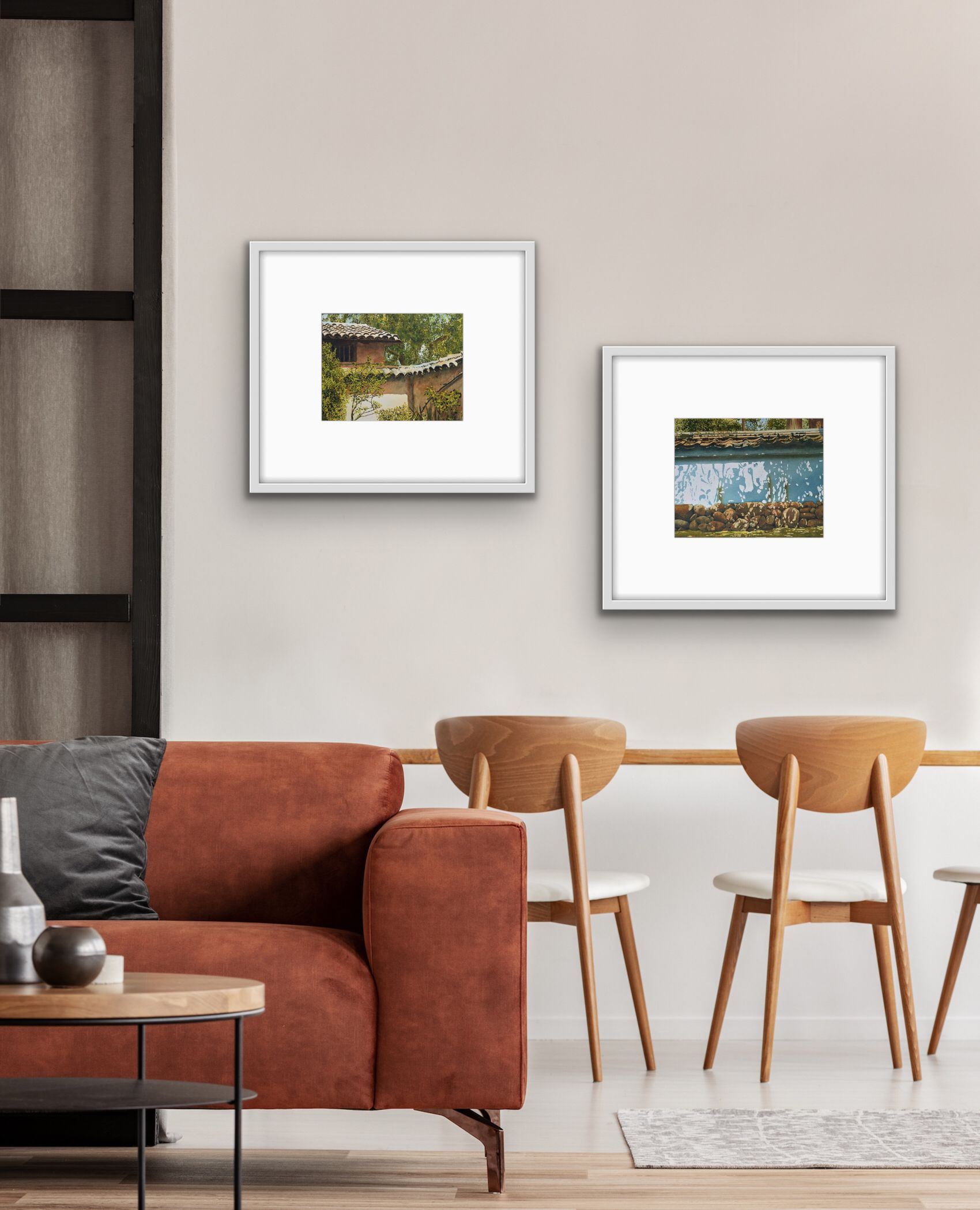 Modern living room with a rust sofa, wooden chairs, and two framed pictures on a beige wall