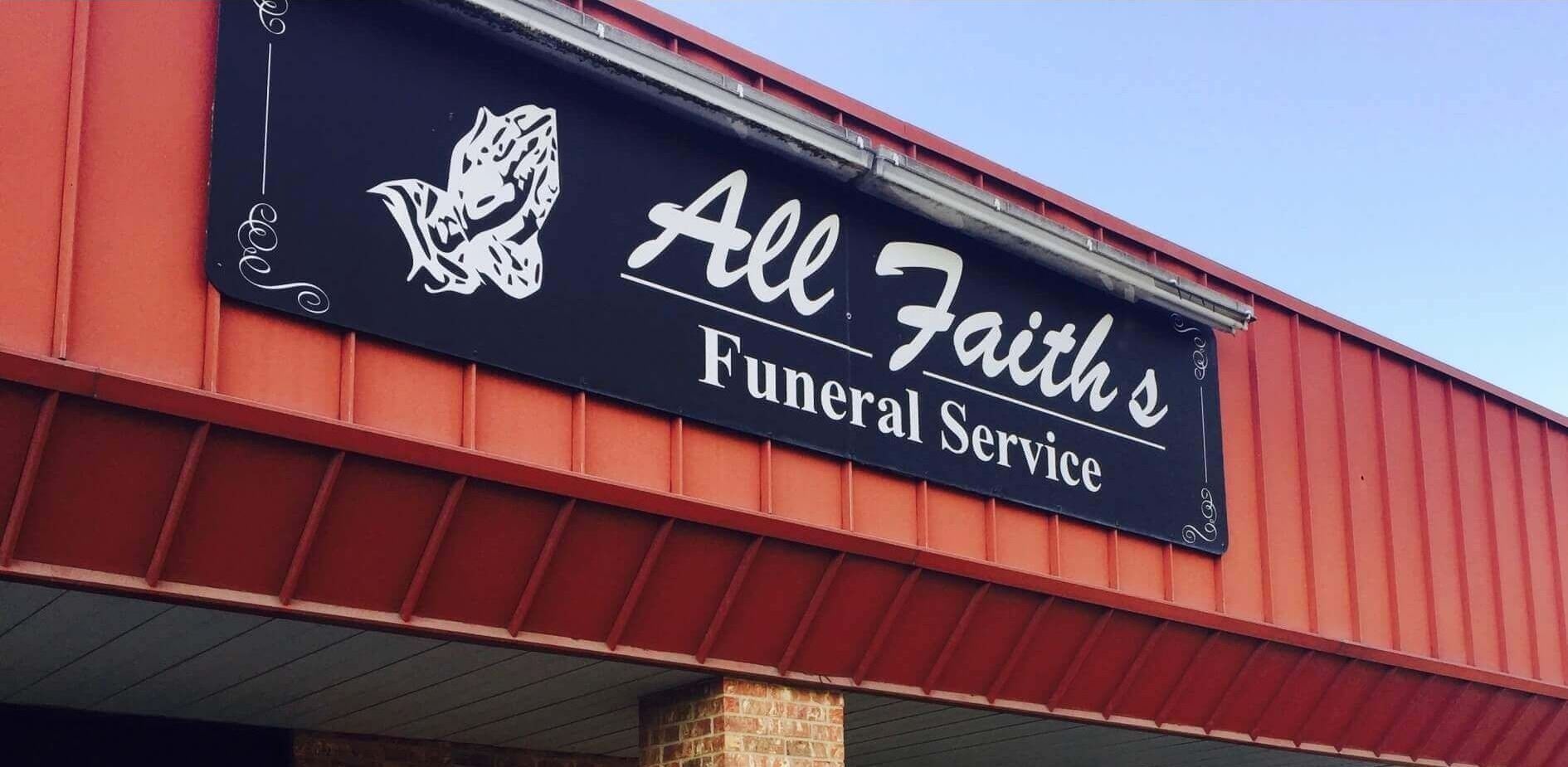 All Faiths Funeral Service sign on a red building roofline