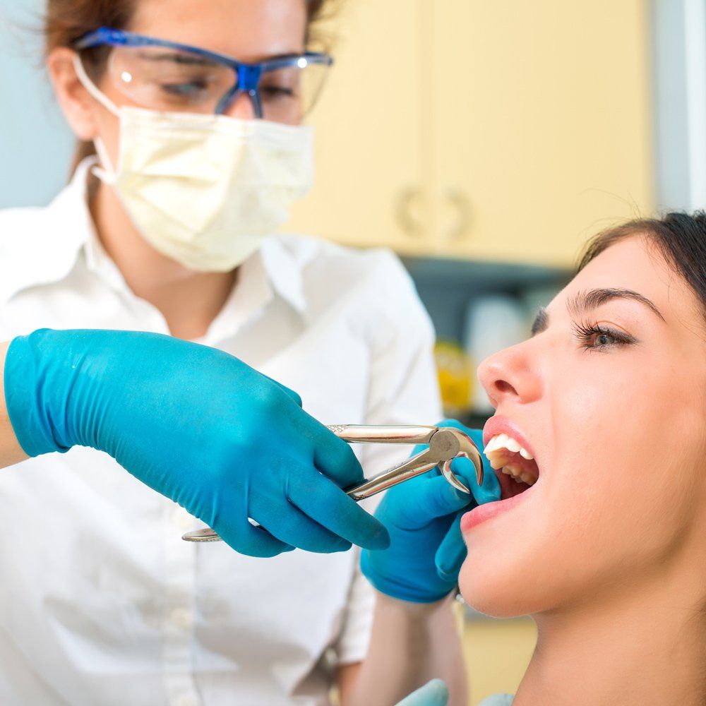 Extracting Woman Tooth — Sarasota, FL — Sterling Dental Extracting Woman Tooth — Sarasota, FL — Sterling Dental
