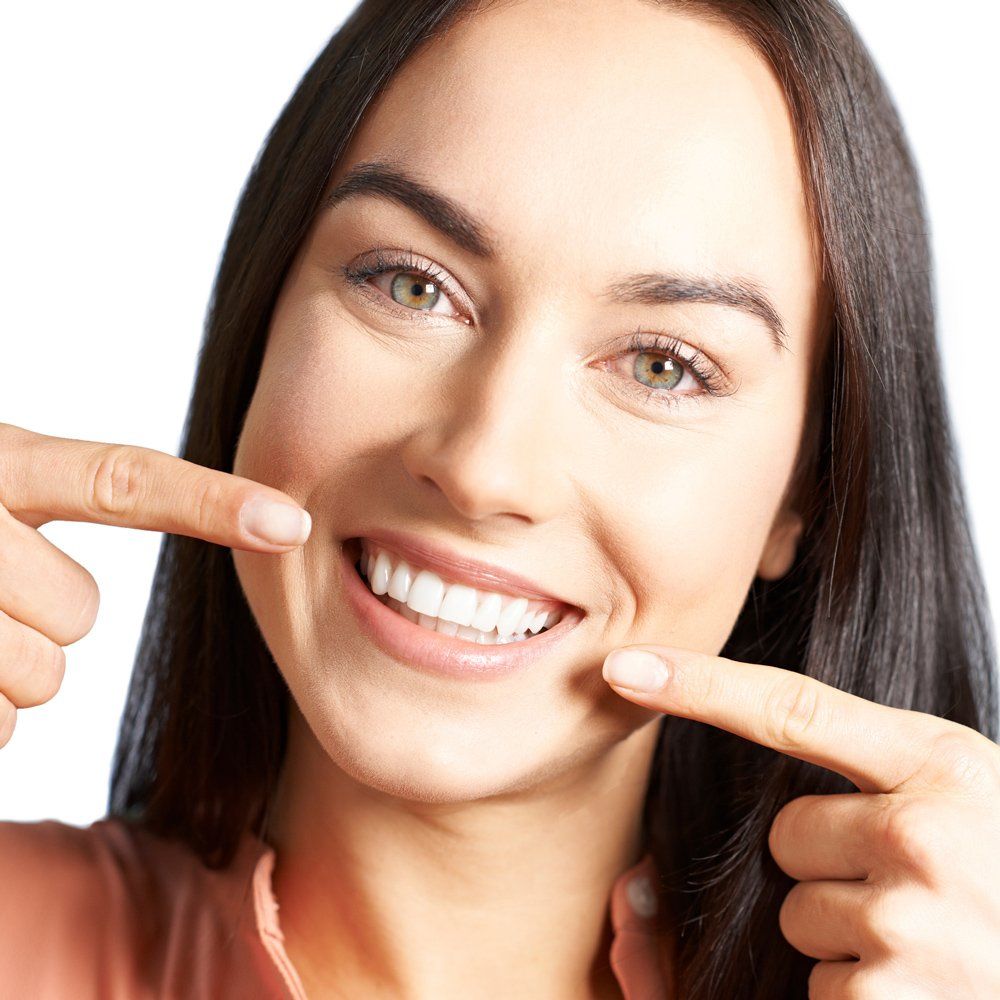 Lady Pointing To Her Teeth — Sarasota, FL — Sterling Dental Lady Pointing To Her Teeth — Sarasota, FL — Sterling Dental