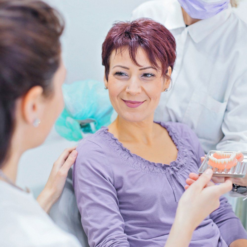 Matured Woman Having A Denture — Sarasota, FL — Sterling Dental