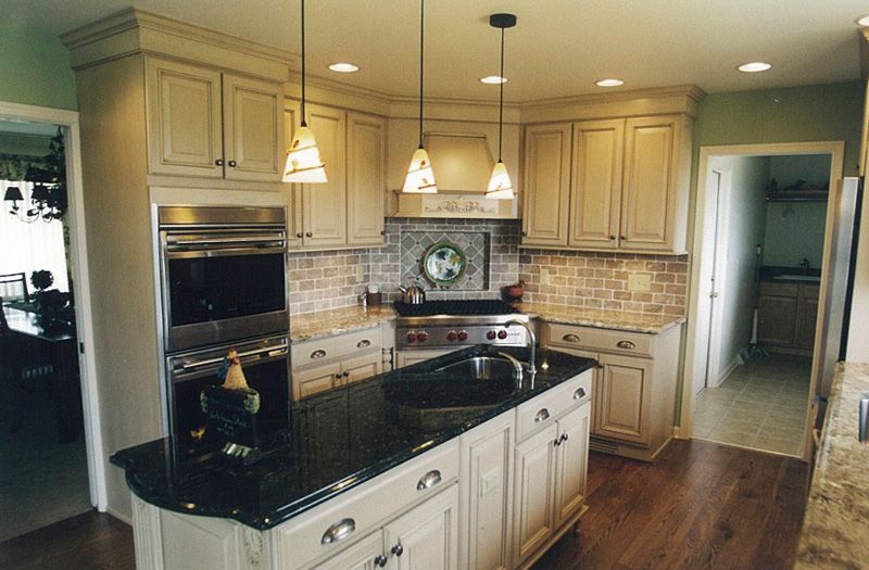 A Kitchen with White Cabinets and Black Counter Tops | York, PA | C&K Cabinetry