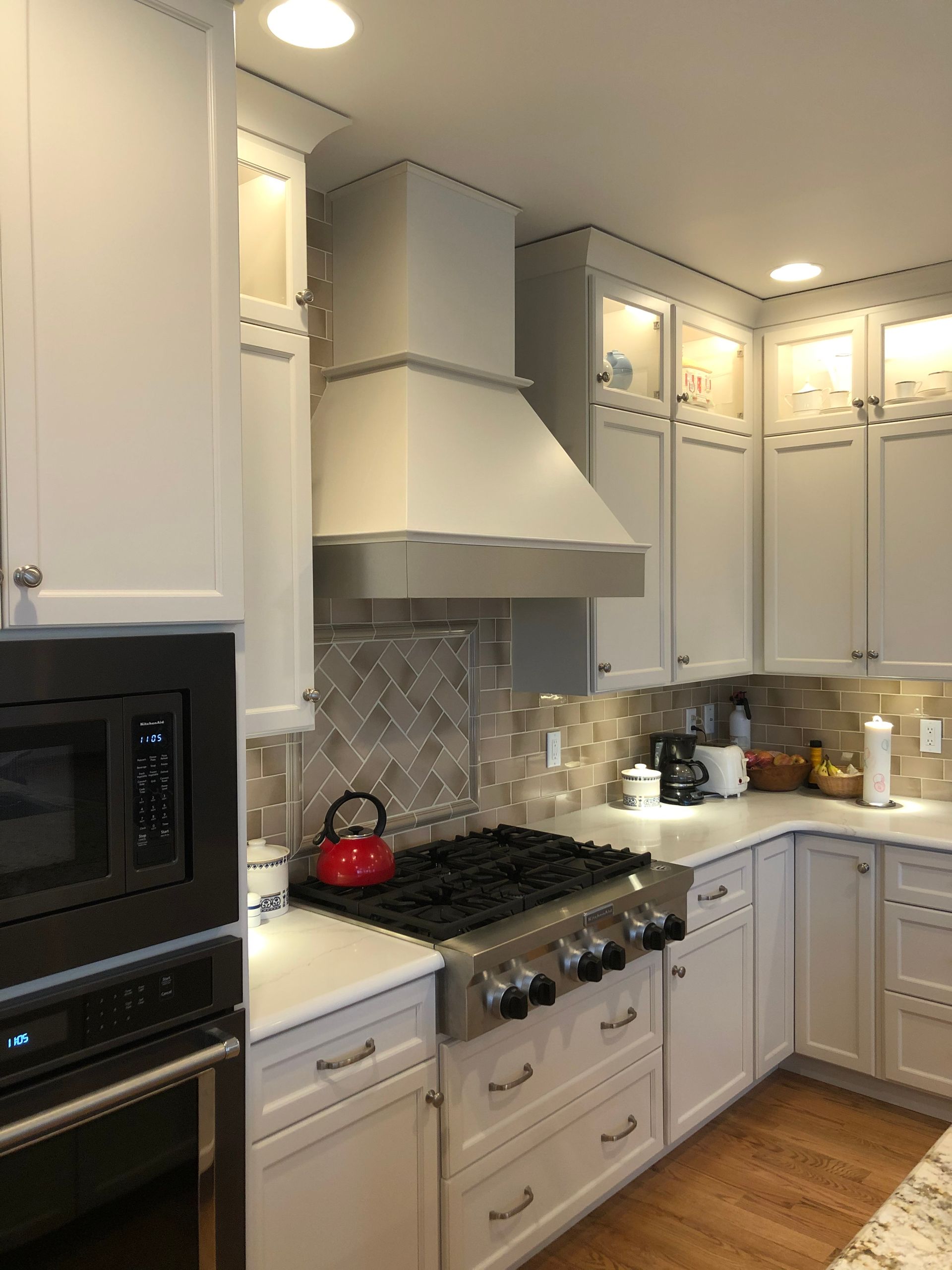 A Kitchen with White Cabinets and A Stove Top Oven | York, PA | C&K Cabinetry