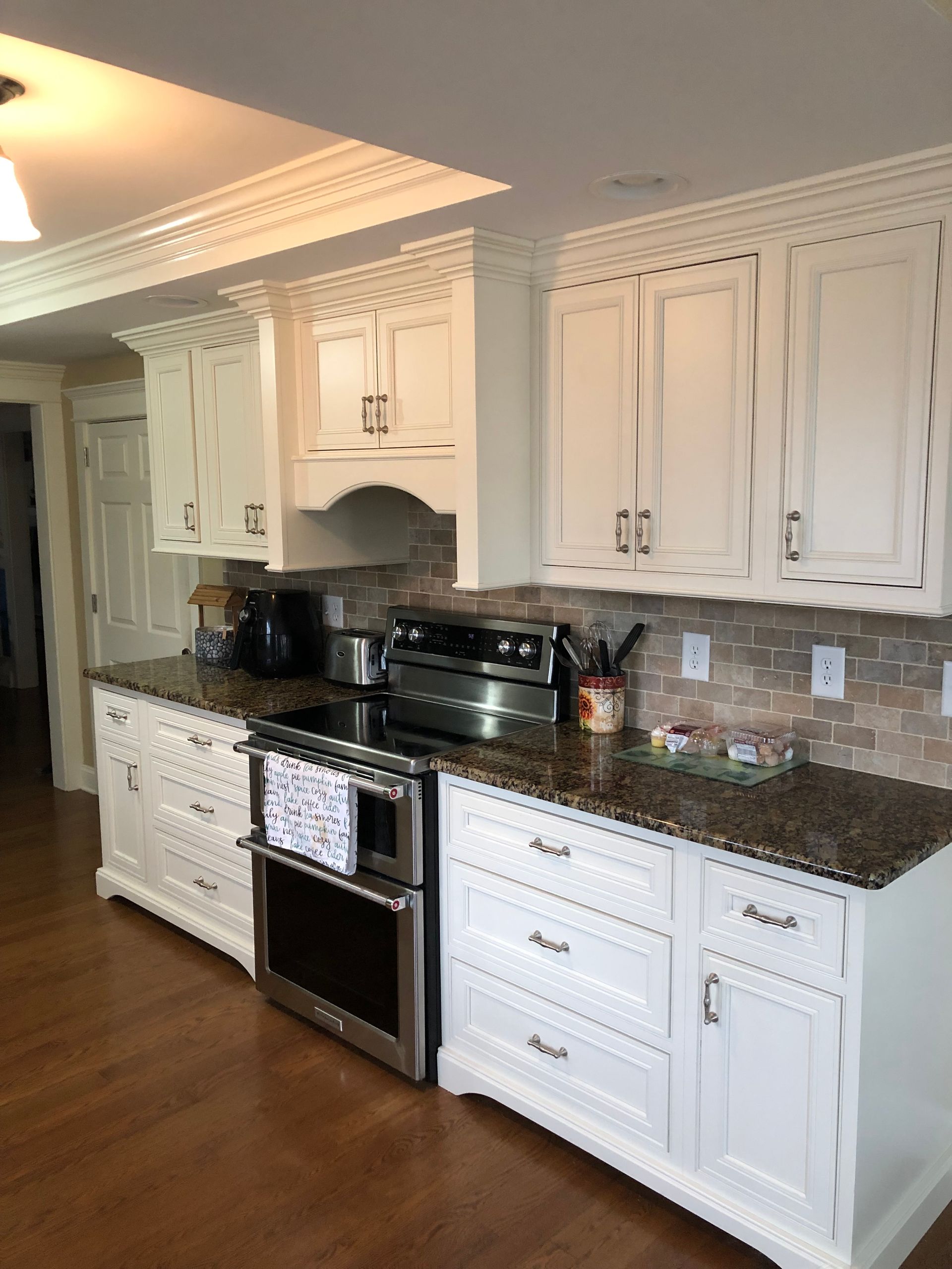 A Kitchen with White Cabinets and Granite Counter Tops | York, PA | C&K Cabinetry