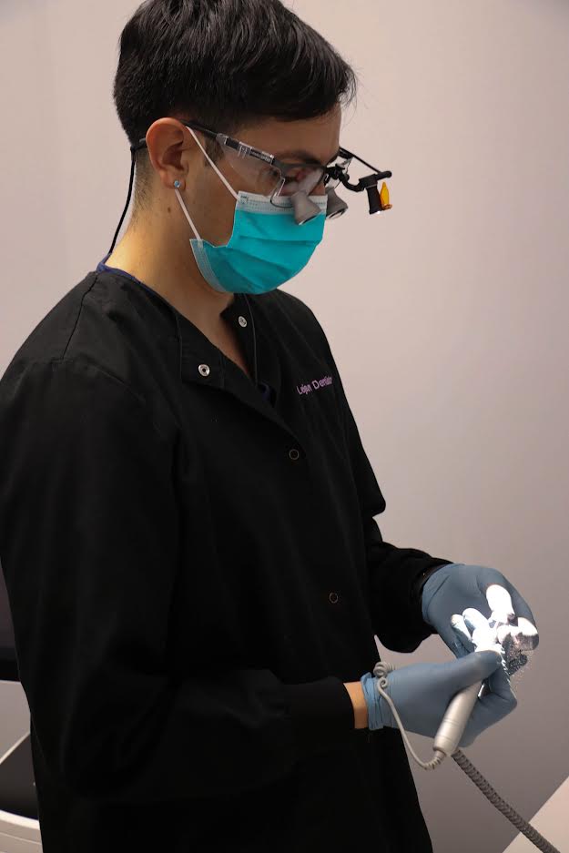 Dentist on Cerec machine