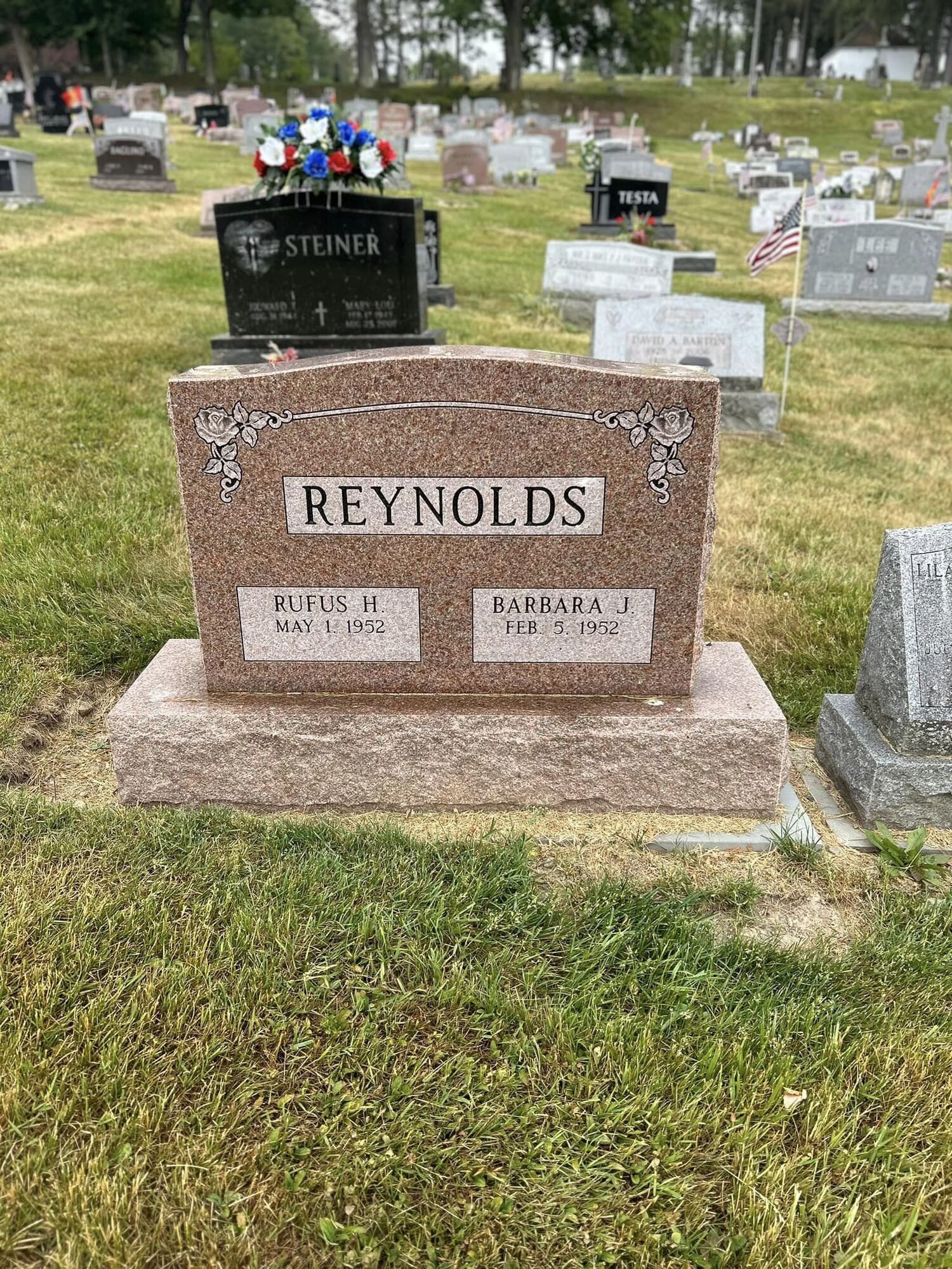 Grave marker in a cemetery with the surname