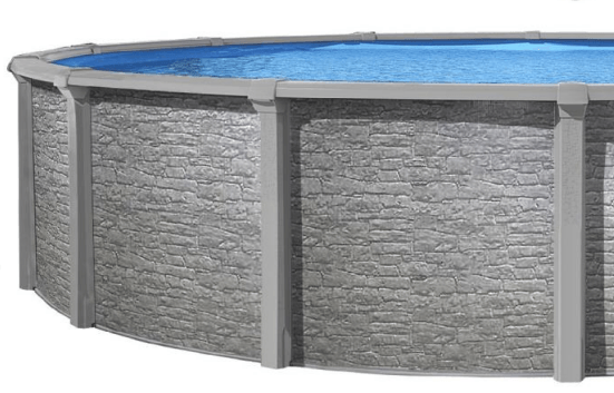 Une piscine ronde avec un mur de briques et une eau bleue.