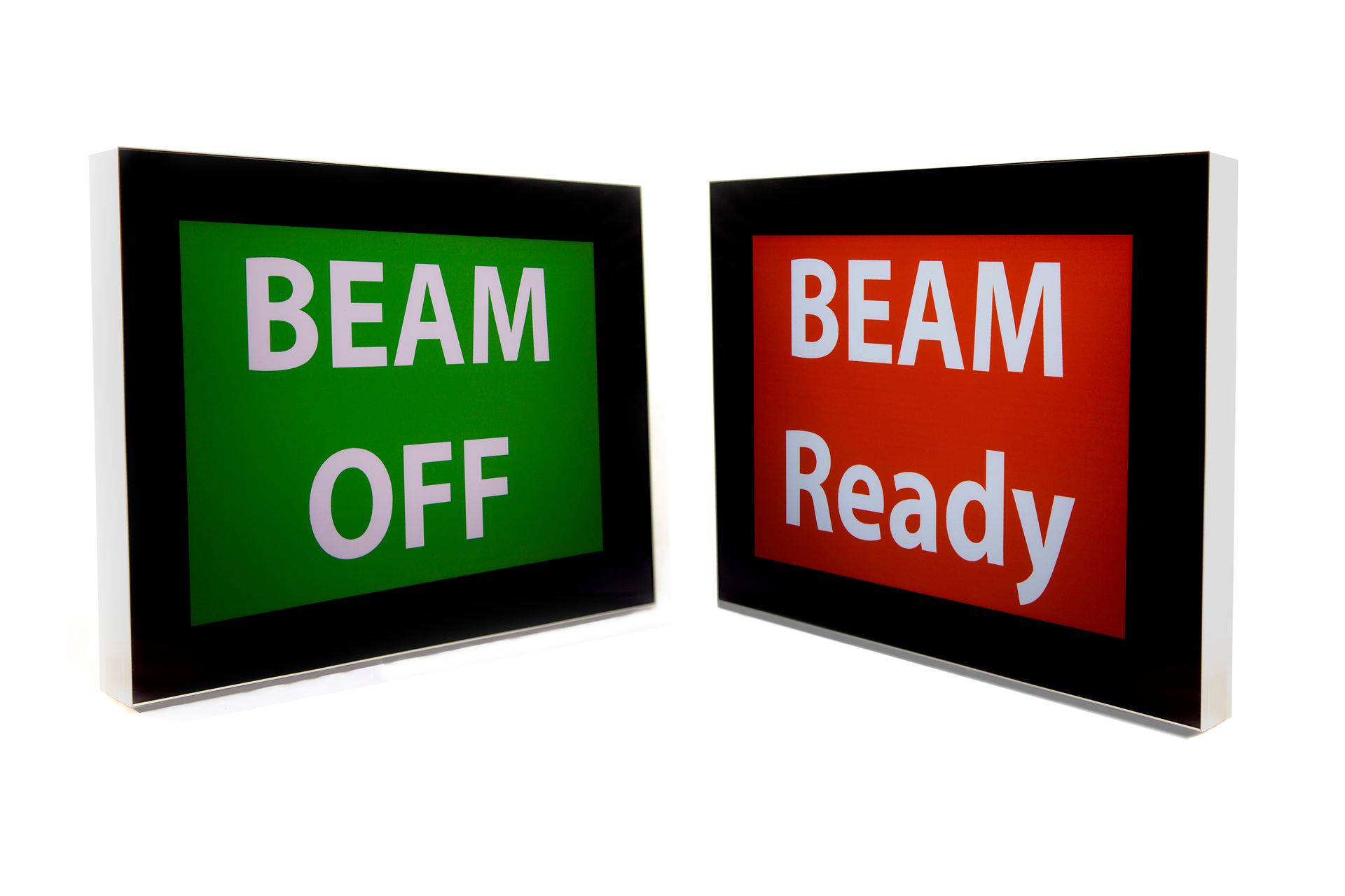 Beam status indicator signage used in radiation-controlled medical environments