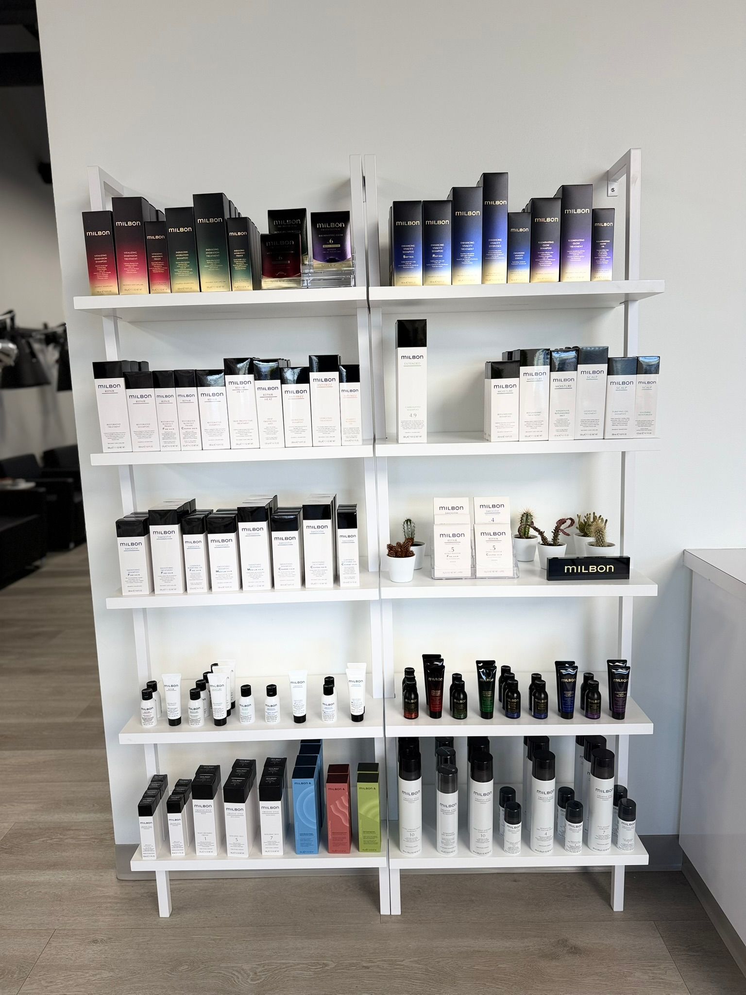White shelf displaying various skincare products.